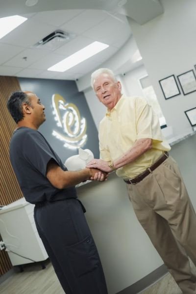 Dentist Smiling in Modern Dental Clinic – Elite Dental Inverness FL
