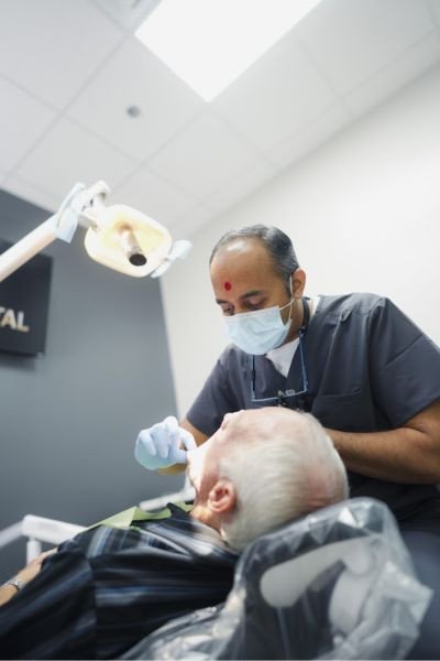 Female Dentist Smiling in Clinic – Elite Dental Inverness FL