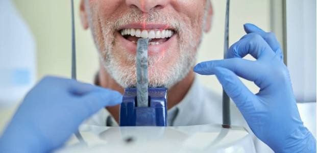 Dentist with Happy Patient After Check-Up – Elite Dental Inverness FL