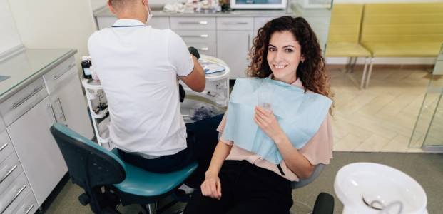 Dentist Performing Cosmetic Dental Treatment – Elite Dental Inverness