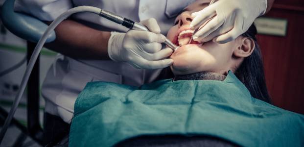 Dentist Performing Routine Check-Up – Elite Dental Inverness FL