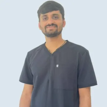 Professional Dentist Smiling – Elite Dental Inverness