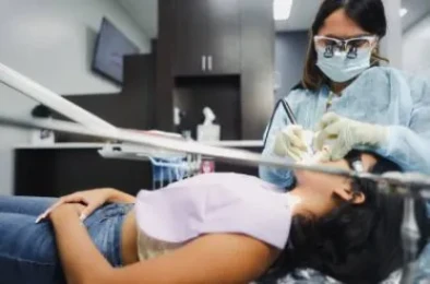 Dentist Examining Patient – Elite Dental Inverness FL